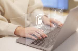 Cybersecurity privacy and data protection concept, Woman using computer secure encryption technology, security of Internet access, security encryption of user private data, business confidentiality.