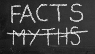 Words written on a chalkboard: "Facts" and, with a strikethrough, "Myths"