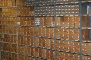 a large quantity of boxes are stored on racks at this records storage warehouse facility